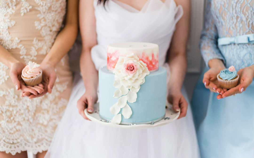 Bridal party holding cupcake